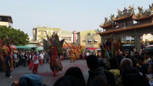 A god struts away in a ceremonial procession outside the Matsu Temple in Anping (開台天后宮).